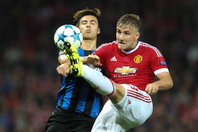 - MANCHESTER, UNITED KINGDOM: Club s Dion Cools and Manchester s Luke Shaw fight for the ball during a soccer game between British club Manchester United ManU FC and Belgian team Club Brugge KV in Manchester, United Kingdom, Tuesday 18 August 2015, the first leg of the play-offs for the UEFA Champions League competition. BRUNOxFAHY x84382263x