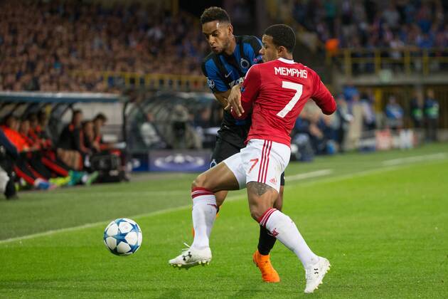 - BRUGGE, BELGIUM: Club s Jean-Charles Castelletto and Manchester s Memphis Depay fight for the ball during a soccer game between Belgian first league team Club Brugge KV and British club Manchester United ManU FC in Brugge, Wednesday 26 August 2015, the return game of the play-offs of the UEFA Champions League competition. Manchester United won the first leg 3-1. KURTxDESPLENTER x84637854x