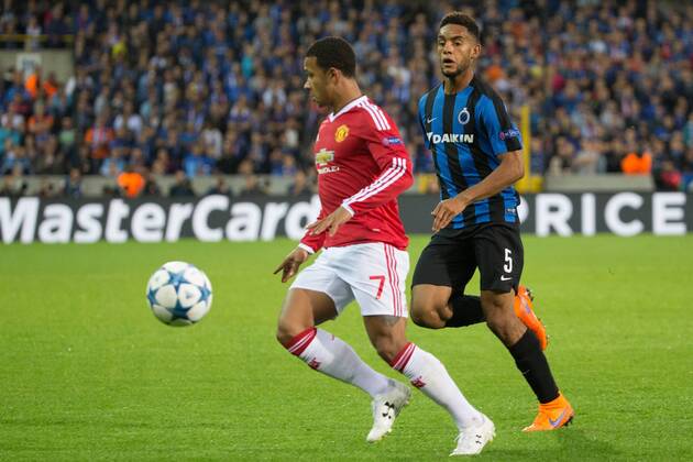- BRUGGE, BELGIUM: Manchester s Memphis Depay and Club s Jean-Charles Castelletto fight for the ball during a soccer game between Belgian first league team Club Brugge KV and British club Manchester United ManU FC in Brugge, Wednesday 26 August 2015, the return game of the play-offs of the UEFA Champions League competition. Manchester United won the first leg 3-1. KURTxDESPLENTER x84637867x
