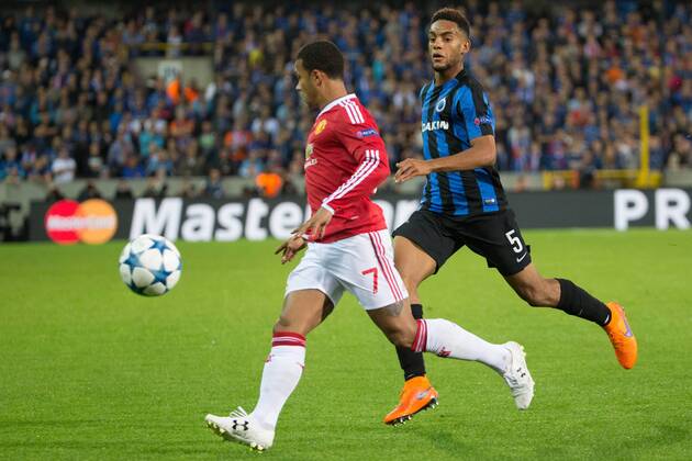 - BRUGGE, BELGIUM: Manchester s Memphis Depay and Club s Jean-Charles Castelletto fight for the ball during a soccer game between Belgian first league team Club Brugge KV and British club Manchester United ManU FC in Brugge, Wednesday 26 August 2015, the return game of the play-offs of the UEFA Champions League competition. Manchester United won the first leg 3-1. KURTxDESPLENTER x84637869x