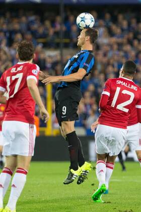 - BRUGGE, BELGIUM: Manchester s Daley Blind, Club s Tom De Sutter and Manchester s Chris Smalling fight for the ball during a soccer game between Belgian first league team Club Brugge KV and British club Manchester United ManU FC in Brugge, Wednesday 26 August 2015, the return game of the play-offs of the UEFA Champions League competition. Manchester United won the first leg 3-1. KURTxDESPLENTER x84637884x