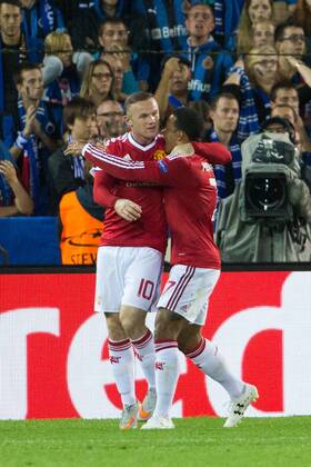- BRUGGE, BELGIUM: Manchester s Wayne Rooney (L) celebrates with his teammates after scoring during a soccer game between Belgian first league team Club Brugge KV and British club Manchester United ManU FC in Brugge, Wednesday 26 August 2015, the return game of the play-offs of the UEFA Champions League competition. Manchester United won the first leg 3-1. KURTxDESPLENTER x84638019x