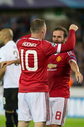 - BRUGGE, BELGIUM: Manchester s Wayne Rooney (L) celebrates with his teammate Juan Mata after scoring during a soccer game between Belgian first league team Club Brugge KV and British club Manchester United ManU FC in Brugge, Wednesday 26 August 2015, the return game of the play-offs of the UEFA Champions League competition. Manchester United won the first leg 3-1. KURTxDESPLENTER x84638962x