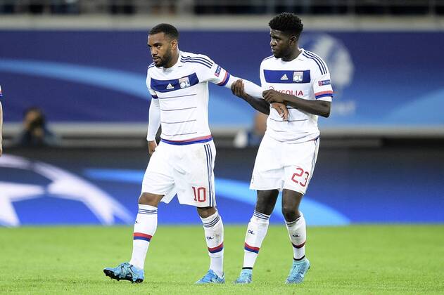 - GENT, BELGIUM: Lyon s Alexandre Lacazette and Lyon s Samuel Umtiti pictured after the first game in the group stage of the Uefa Champions League competition, in group H, between Belgian first league soccer team KAA Gent and Olympique Lyon, in Gent, Wednesday 16 September 2015. YORICKxJANSENS x85282432x