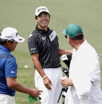 Golf: Matsuyama at Masters Tournament Hideki Matsuyama of Japan (C) smiles at a practice field for the U.S. Masters Tournament in Augusta, Georgia, on April 2, 2018. 