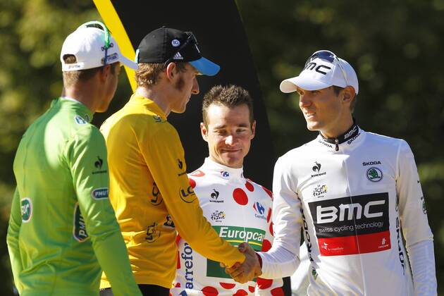 - PARIS, FRANCE: Slovakian Peter Sagan of Liquigas-Cannondale with the green jersey, British Bradley Wiggins of Sky Procycling Team with the yellow jersey, French Thomas Voeckler of Europcar with the white jersey with red dots (polka-dot) and US Tejay Van Garderen of BMC Racing Team with the white Jersey pictured on the podium after the 20th and last stage of the 99th edition of the Tour de France cycling race, 130km from Rambouillet to the Champs-Elysees, Paris, France, Sunday 22 July 2012. KRISTOFxVANxACCOM x36717673x