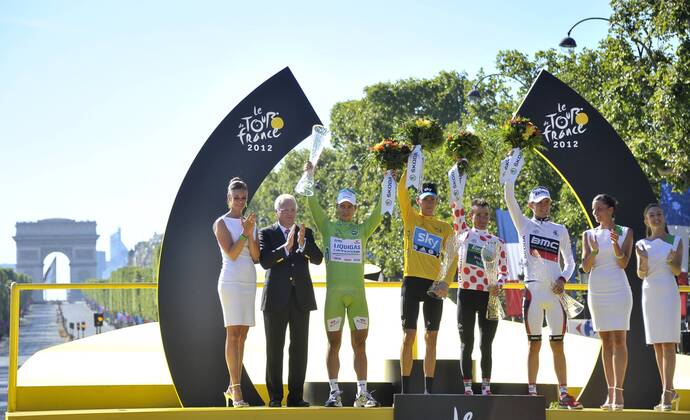 - PARIS, FRANCE: Slovakian Peter Sagan of Liquigas-Cannondale with the green jersey (3 L), British Bradley Wiggins of Sky Procycling Team with the yellow jersey (C), French Thomas Voeckler of Europcar with the white jersey with red dots (polka-dot) (C R) and US Tejay Van Garderen of BMC Racing Team (3 R) with the white Jersey pictured on the podium after the 20th and last stage of the 99th edition of the Tour de France cycling race, 130km from Rambouillet to the Champs-Elysees, Paris, France, Sunday 22 July 2012. NICOLASxBOUVY x36717828x