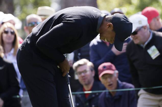 Tiger Woods reacts after hits tee shot on the 4th hole in the 1st round of the 2018 Masters Tournament at the Augusta National Golf Club in Augusta, Georgia, on April 5, 2018.  AUG20180405119 JOHNxANGELILLO