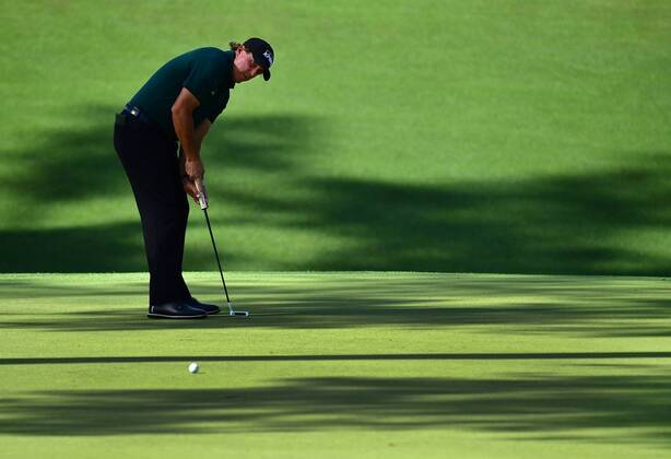 Phil Mickelson putts on the 10th green during the first round of the 2018 Masters Tournament at the Augusta National Golf Club in Augusta, Georgia, on April 5, 2018.  AUG20180405347 KEVINxDIETSCH