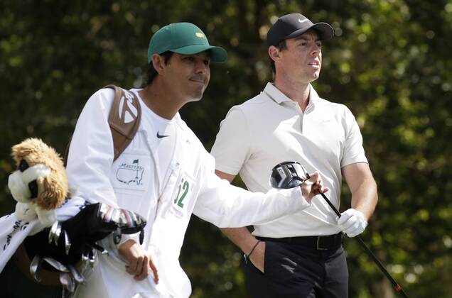 Rory McIlroy of Norther Ireland walks from the 2nd hole tee box wth caddie Harry Diamond after his tee shot in the 2nd round of the 2018 Masters Tournament at the Augusta National Golf Club in Augusta, Georgia, on April 6, 2018.  AUG20180406119 JOHNxANGELILLO