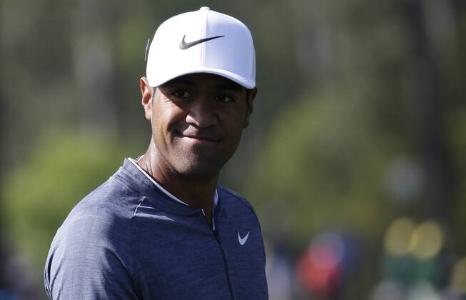 Tony Finau smiles at patrons as he walks up the fairway on the 3rd hole in the 2nd round of the 2018 Masters Tournament at the Augusta National Golf Club in Augusta, Georgia, on April 6, 2018.  AUG20180406109 JOHNxANGELILLO