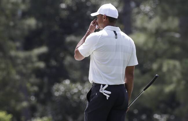 Tiger Woods reacts after missing a par putt on the first hole in the 2nd round of the 2018 Masters Tournament at the Augusta National Golf Club in Augusta, Georgia, on April 6, 2018.  AUG20180406128 JOHNxANGELILLO