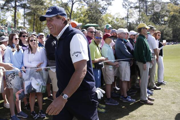 Phil Mickelson smiles as he walks to the second hole tee box in the 2nd round of the 2018 Masters Tournament at the Augusta National Golf Club in Augusta, Georgia, on April 6, 2018.  AUG20180406140 JOHNxANGELILLO