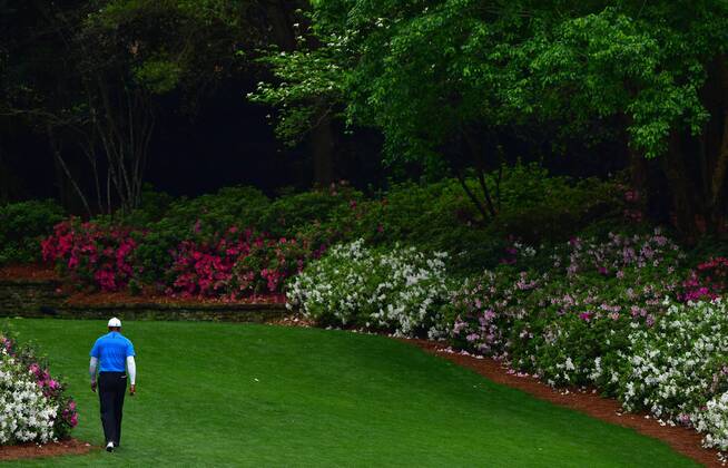 Tiger Woods walks to the 13th tee during the third round of the 2018 Masters Tournament at the Augusta National Golf Club in Augusta, Georgia, on April 7, 2018.  AUG20180407309 KEVINxDIETSCH