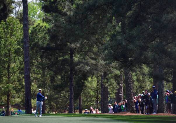 Jon Rahm of Spain hits his approach shot to the 1st hole in the final round of the 2018 Masters Tournament at the Augusta National Golf Club in Augusta, Georgia, on April 8, 2018.  AUG20180408108 KEVINxDIETSCH