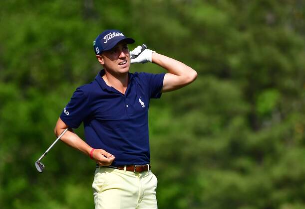 Justin Thomas reacts after hitting off the 12th tee during the fourth round of the 2018 Masters Tournament at the Augusta National Golf Club in Augusta, Georgia, on April 8, 2018.  AUG20180408330 KEVINxDIETSCH