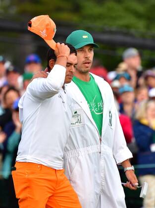 Rickey Fowler is reacts next to his caddie Joe Skovron after finishing his final round of the 2018 Masters Tournament at the Augusta National Golf Club in Augusta, Georgia, on April 8, 2018. Fowler finished second with 14-under-par  AUG20180408336 KEVINxDIETSCH