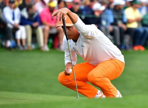 Rickey Fowler lines up a putt on the 18th green on the final day of the 2018 Masters Tournament at the Augusta National Golf Club in Augusta, Georgia, on April 8, 2018. Fowler finished second with 14-under-par  AUG20180408337 KEVINxDIETSCH