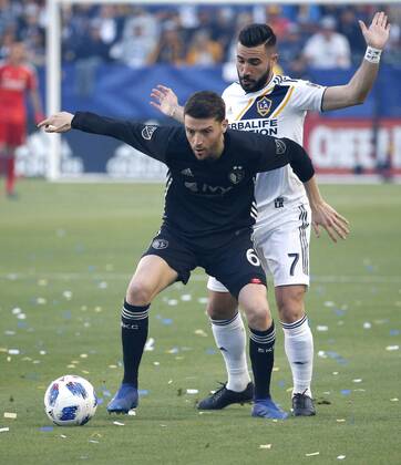 April 8, 2018 - Los Angeles, California, U.S - Sporting Kansas Citys midfielder Ilie Sanchez (6) of Spain, vies with Los Angeles Galaxys midfielder Romain Alessandrini (7) of France, during the 2018 Major League Soccer MLS Fussball Herren USA match between Los Angeles Galaxy and Sporting Kansas City in Carson, California, April 8, 2018. Sporting Kansas City won 2-0. MLS 2018: Los Angeles Galaxy 0-2 Sporting Kansas City - ZUMAc68_ 20180408_zaf_c68_009 Copyright: xRingoxChiux