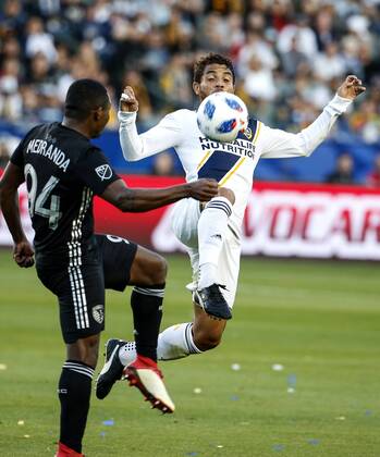 April 8, 2018 - Los Angeles, California, U.S - Sporting Kansas Citys defender Jimmy Medranda (94) of Colombia vies with Los Angeles Galaxys midfielder Jonathan dos Santos (8) during the 2018 Major League Soccer MLS Fussball Herren USA match between Los Angeles Galaxy and Sporting Kansas City in Carson, California, April 8, 2018. Sporting Kansas City won 2-0. MLS 2018: Los Angeles Galaxy 0-2 Sporting Kansas City - ZUMAc68_ 20180408_zaf_c68_018 Copyright: xRingoxChiux