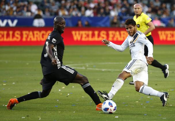 April 8, 2018 - Los Angeles, California, U.S - Sporting Kansas Citys defender Ike Opara (3) vies with Los Angeles Galaxys midfielder Jonathan dos Santos (8) during the 2018 Major League Soccer MLS Fussball Herren USA match between Los Angeles Galaxy and Sporting Kansas City in Carson, California, April 8, 2018. Sporting Kansas City won 2-0. MLS 2018: Los Angeles Galaxy 0-2 Sporting Kansas City - ZUMAc68_ 20180408_zaf_c68_032 Copyright: xRingoxChiux