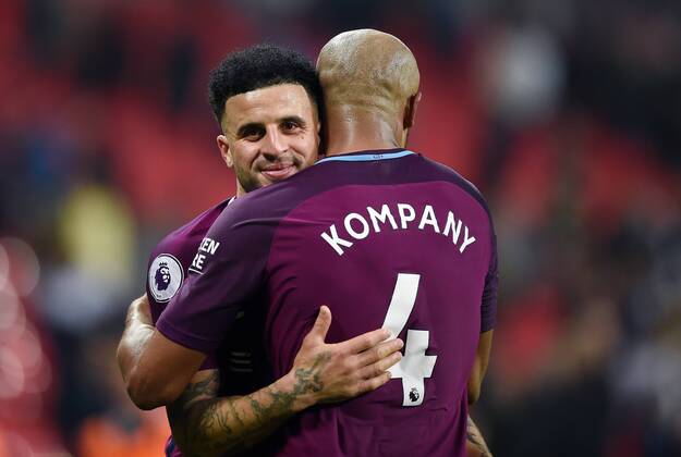 Vincent Kompany of Manchester City and Kyle Walker of Manchester City celebrate at the end of the premier league match at the Wembley Stadium, London. Picture date 14th April 2018. Picture credit should read: Robin Parker Sportimage EDITORIAL USE ONLY. No use with unauthorised audio, video, data, fixture lists, club league logos or live services. Online in-match use limited to 120 images, no video emulation. No use in betting, games or single club league player publications. HIP_1575