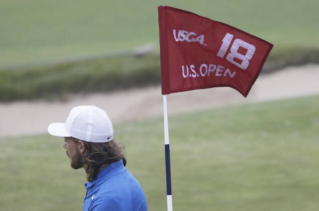 Tommy Fleetwood from England stand on the 18th green during a practice round on the Wednesday before the 118th U.S. Open Championship at Shinnecock Hills Golf Club in Southampton, New York on June 13, 2018.  NYP20180613304 JOHNxANGELILLO