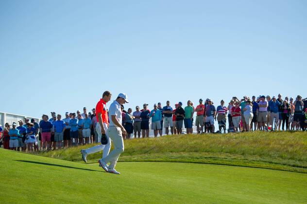 Jordan Spieth from the United States (l.) and Rory McIlroy from Northern Ireland walk on the 10th fairway in the first round of the 118th U.S. Open Championship at Shinnecock Hills Golf Club in Southampton, New York on June 14, 2018.  NYP20180614111 COREYxSIPKIN