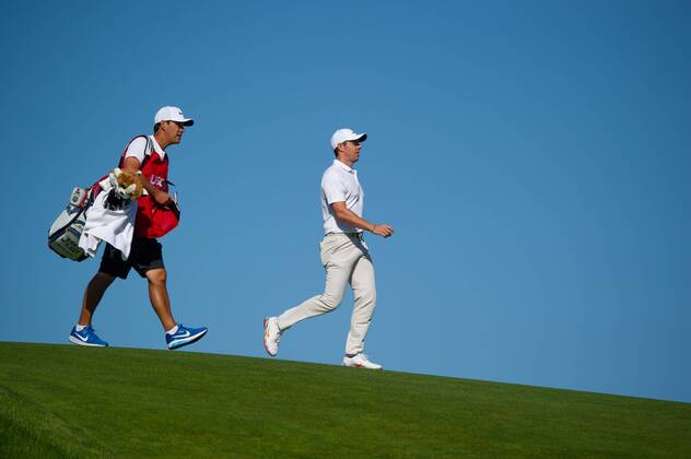 Rory McIlroy from Northern Ireland and caddy Harry Diamond walk on 12th fairway in the first round of the 118th U.S. Open Championship at Shinnecock Hills Golf Club in Southampton, New York on June 14, 2018.  NYP20180614126 COREYxSIPKIN