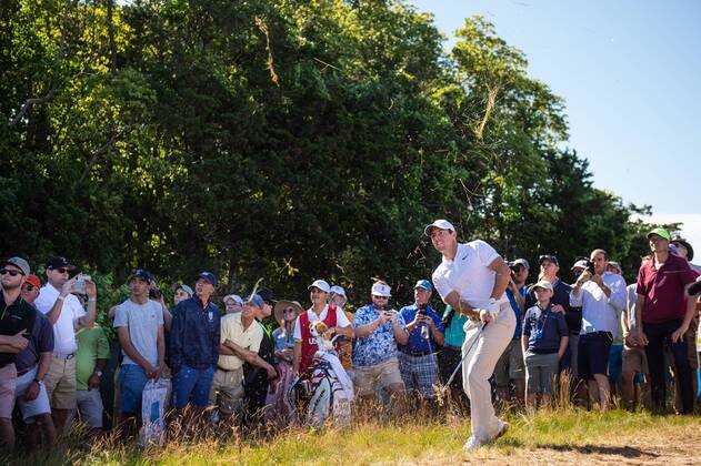 Rory McIlroy from Northern Ireland hits out of the rough on the 12th fairway in the first round of the 118th U.S. Open Championship at Shinnecock Hills Golf Club in Southampton, New York on June 14, 2018.  NYP20180614129 COREYxSIPKIN