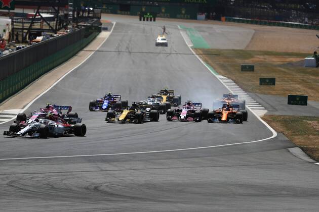 8th July 2018, Silverstone Circuit, Silverstone, England; British Formula One Grand Prix, Race Day; Sahara Force India, Sergio Perez locks up into Turn 1 and comes close to McLaren, Fernando Alonso  ActionPlus12045468 Octane