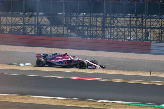 8th July 2018, Silverstone Circuit, Silverstone, England; British Formula One Grand Prix, Race Day; Sahara Force India, Sergio Perez locks up into Turn 1 and demolishes one of the trackside signs  ActionPlus12045477 Octane
