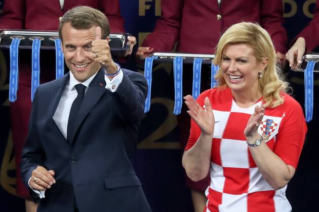 MOSCOW, RUSSIA - JULY 15, 2018: France s President Emmanuel Macron (L) and Croatia s President Kolinda Grabar-Kitarovic during an award ceremony after the 2018 FIFA World Cup WM Weltmeisterschaft Fussball Final match between France and Croatia at Luzhniki Stadium. Stanislav Krasilnikov TASS  TS089A97