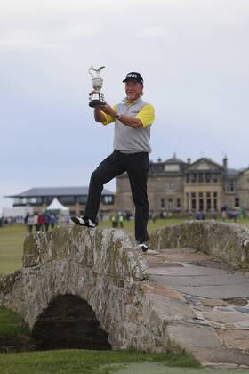 29th July 2018, Old Course at St Andrews, St Andrews, Scotland; The 2018 Senior Open Golf Championships, 4th round; This year s winner Miguel Angel Jimenez (ESP) poses with the Senior Open trophy on the Swilken Bridge on the 18th hole of the Old course  ActionPlus12051763 AlanxMartin
