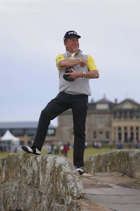 29th July 2018, Old Course at St Andrews, St Andrews, Scotland; The 2018 Senior Open Golf Championships, 4th round; This year s winner Miguel Angel Jimenez (ESP) poses with the Senior Open trophy on the Swilken Bridge on the 18th hole of the Old course  ActionPlus12051764 AlanxMartin