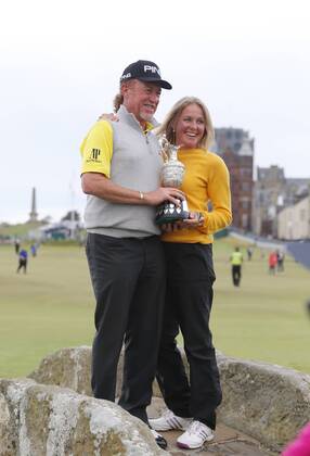 29th July 2018, Old Course at St Andrews, St Andrews, Scotland; The 2018 Senior Open Golf Championships, 4th round; This year s winner Miguel Angel Jimenez (ESP) along with his wife poses with the Senior Open trophy on the Swilken Bridge on the 18th hole of the Old course  ActionPlus12051765 AlanxMartin