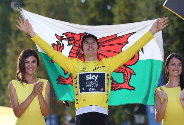 Geraint Thomas of Great Britain celebrates on the presentation podium after winning the Tour de France in Paris on July 29, 2018. Thomas claimed his first Tour de France victory, becoming the first Welshman to win the event.  PAR20180729157 DAVIDxSILPA