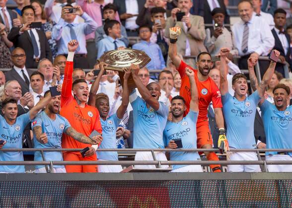 Vincent Kompany of Manchester City and Fernandinho of Manchester City lift the FA Community Shield during the The FA Community Shield Final match between Chelsea and Manchester City at Stamford Bridge, London, England on 5 August 2018. Copyright: xVincexxMignottx PMI-2135-0037