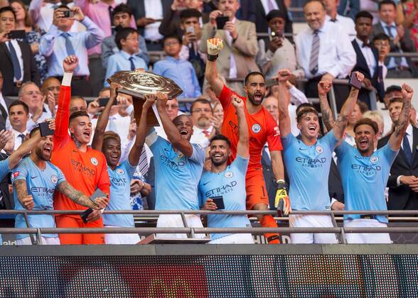 Vincent Kompany of Manchester City and Fernandinho of Manchester City lift the FA Community Shield during the The FA Community Shield Final match between Chelsea and Manchester City at Stamford Bridge, London, England on 5 August 2018. Copyright: xVincexxMignottx PMI-2135-0038