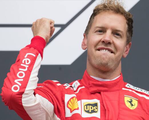 Ferrari s German driver Sebastian Vettel celebrates on the podium after winning the Spa-Francorchamps Formula One Grand Prix of Belgium race, in Spa-Francorchamps, Sunday 26 August 2018. BENOITxDOPPAGNE x05414415x