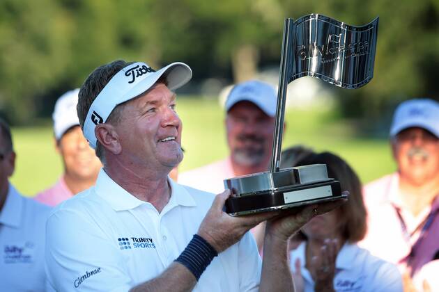 September 16, 2018 - Grand Blanc, Michigan, United States - Paul Broadhurst of England holds up the trophy after winning The Ally Challenge presented by McLaren at Warwick Hills Golf & Country Club in Grand Blanc, MI, USA Sunday, September 16, 2018. The Ally Challenge - Final Round  - ZUMAn230 20180916_zaa_n230_981 Copyright: xJorgexLemusx