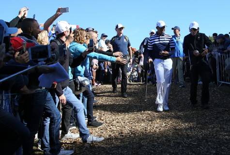 Tiger Woods hits interacts with fans during a Ryder Cup 2018 practice session at Le Golf National in Guyancourt near Paris on September 26, 2018. The three-day tournament features Team USA versus Team Europe and starts Friday, September 28th.  PAR20180926056 DAVIDxSILPA