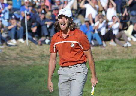 Tommy Fleetwood reacts after making a putt on the 9th green on day two of the Ryder Cup at Le Golf National in Guyancourt near Paris on September 29, 2018. Fleetwood and teammate Francesco Molinari won the 9th hole against Tiger Woods and Bryson DeChambeau.  PAR20180929034 DAVIDxSILPA