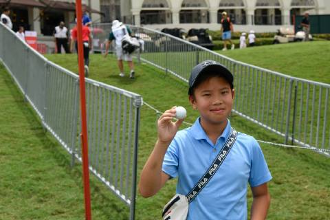 October 11, 2018 - Kuala Lumpur, Malaysia - A boy holds a ball given by Marc Leishman of Australia during the first round of the CIMB Classic at TPC Kuala Lumpur on 11 October, 2018 in Kuala Lumpur, Malaysia CIMB Classic - Round One  - ZUMAn230 20181011_zaa_n230_139 Copyright: xChrisxJungx