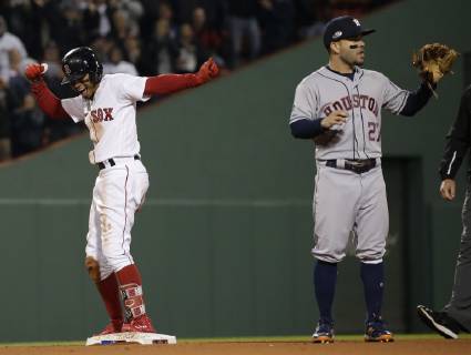 Sport Themen der Woche KW41 Sport Bilder des Tages Boston Red Sox Mookie Betts (R) celebrates after doubling home a run against Houston Astros second baseman Jose Altuve during the eighth inning in game two of the American League Championship Series at Fenway Park in Boston, Massachusetts on October 14, 2018. The Astros hold a 1-0 series lead over the Red Sox.  BOS2018101441 JOHNxANGELILLO