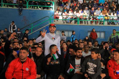January 11, 2019 - Rafah, Gaza Strip, Palestinian Territory - Palestinian fans watch the 2019 AFC Asian Cup Group B football match between Palestine and Australia, in Rafah in the souhtern Gaza Strip on January 11, 2019. The match ended in 3-0 to Australia Middle East News - January 11, 2019 - ZUMAap3_ 88356686st Copyright: xAlixHamadx