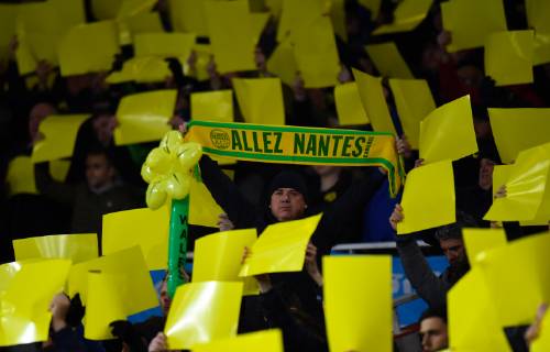 Football - 2018 2019 Premier League - Arsenal vs. Cardiff City A Cardiff City fan holds aloft a Nantes flag, the club that Emiliano Sala was leaving Cardiff city for, at The Emirates. COLORSPORT ASHLEY WESTERN