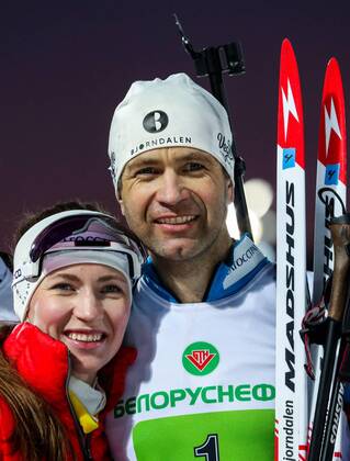 MINSK REGION, BELARUS - FEBRUARY 18, 2019: Darya Domracheva of Belarus (L) and Norway s Ole Einar Bjorndalen at the Legends Race biathlon festival at the Raubichi Olympic Centre in Ostroshitsky Gorodok, Minsk Region. Natalia Fedosenko TASS  TS0A1790