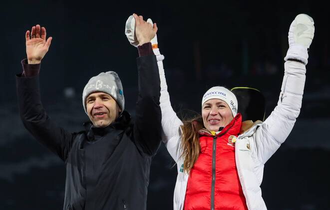 MINSK REGION, BELARUS - FEBRUARY 18, 2019: Norway s Ole Einar Bjorndalen Bjoerndalen (L) and Darya Domracheva of Belarus, who finished second in the mixed relay race, celebrate during the victory ceremony at the Legends Race biathlon festival at the Raubichi Olympic Centre in Ostroshitsky Gorodok, Minsk Region. Natalia Fedosenko TASS  TS0A17C5