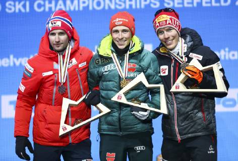 NORDIC SKIING - FIS Nordic World Ski Championships Seefeld 2019 SEEFELD,AUSTRIA,22.FEB.19 - NORDIC SKIING, CROSS COUNTRY SKIING - FIS Nordic World Ski Championships, medal plaza, award ceremony, sprint, men. Image shows Jan Schmid (NOR), Eric Frenzel (GER) and Franz-Josef Rehrl (AUT). GEPAxpictures xCh.xKelemen